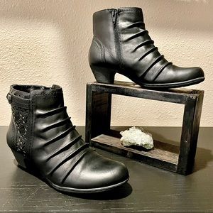 Beautiful Rockport Brynn booties with laser cut & ruched accents leather.